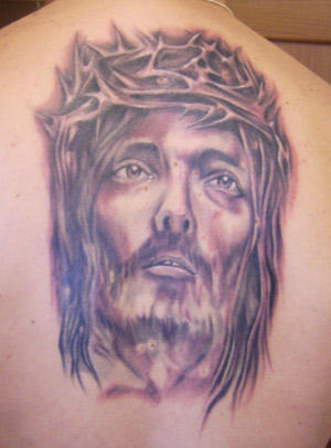 Tatuaggio del volto di Cristo